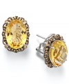 Add a touch of sunshine. These stunning sterling silver earrings highlight an oval-cut citrine (9-1/2 ct. t.w.) and a halo of round-cut yellow Swarovski zirconias (1/2 ct. t.w.). Approximate length: 3/4 inch. Approximate width: 1/2 inch.