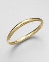 From the Glamazon Collection. A simple yet stunning bangle of undulating 18k gold with a rich hammered finish. 18k goldDiameter, about 2.75Slip-on styleImported