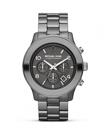 This brushed stainless steel watch by Michael Kors is a solid piece of fashion hardware, completed with a striking titanium ceramic case and black diamond accents. This brushed stainless steel watch by Michael Kors is a solid piece of fashion hardware, completed with a striking titanium ceramic case and black diamond accents.