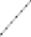 Stunning in sapphire. Victoria Townsend's standout tennis bracelet features round-cut sapphires (5 ct. t.w.) and sparkling diamond accents. Crafted in sterling silver. Approximate length: 7 inches.