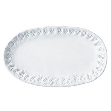 Handmade and inspired by the maestro artisan's family heirloom dinnerware, this white platter makes an elegant display for appetizers. Handmade and inspired by the maestro artisan's family heirloom dinnerware, this white platter makes an elegant display for appetizers.