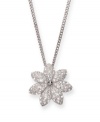 Fanciful in floral. This pendant features a sparkling flower motif decorated with clear crystals in Swarovski's signature Pointiage® technique. Setting and chain crafted in silver tone mixed metal. Approximate length: 15 inches. Approximate drop: 1/2 inch.