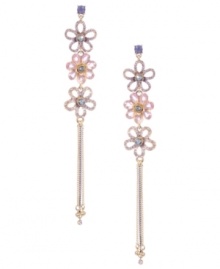 Sweet shoulder dusters. Betsey Johnson romanticizes the latest trend with the addition of three shimmering flower charms. Crafted in antique gold-plated mixed metal with pink, purple, and blue crystal accents. Approximate drop: 5-1/2 inches. Sweet shoulder dusters. Betsey Johnson romanticizes the latest trend with the addition of three shimmering flower charms. Crafted in antique gold-plated mixed metal with pink, purple, and blue crystal accents. Approximate drop: 5-1/2 inches.