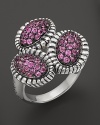 Fluted edges in sterling silver frame sparkling pink sapphires. From Lagos.