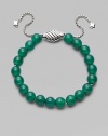 Rich green onyx is fastened by an adjustable clasp of sterling silver.Green onyx Sterling silver Bead diameter, about ¾ Imported