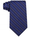 Standout stripes amp up any night out with this sharp silk tie from Calvin Klein.