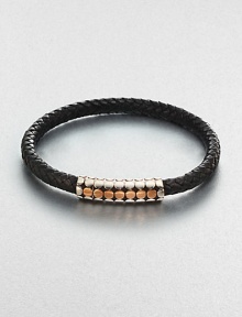 A simple design with modern sensibilities defines this woven leather bracelet, accented by a sterling silver and gold clasp.Sterling silver/GoldLeatherMagnetic claspAbout 3 diam.Imported