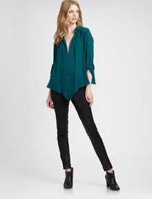 A delicate design made from sophisticated silk. This button-front top features a pleated, plunge front and convenient roll-tab sleeves. Collar neckRoll-tab sleevesDropped shouldersPleated frontButton frontAbout 26 from shoulder to hemSilkDry cleanImported Model shown is 5'10 (177cm) wearing US size Small. A delicate design made from sophisticated silk. This button-front top features a pleated, plunge front and convenient roll-tab sleeves. Collar neckRoll-tab sleevesDropped shouldersPleated frontButton frontAbout 26 from shoulder to hemSilkDry cleanImported Model shown is 5'10 (177cm) wearing US size Small.
