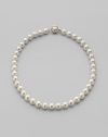 A classic strand of white organic man-made pearls is essential elegance. 10mm white round pearls Length, about 18 18k gold vermeil and mabé pearl push-lock clasp Made in Spain