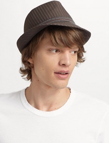Cool pinstripes and an embroidered band make an instant headliner that goes from casual to dressy affairs.Brim, 1¼ W Logo on the band Fully lined Cotton Imported