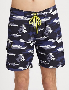 Classic, camo print adorns these swim trunks shaped in quick-drying nylon, with a drawstring waist for an easy-fit.Drawstring tie waistSide cargo pocketInseam, about 9NylonMachine washImported