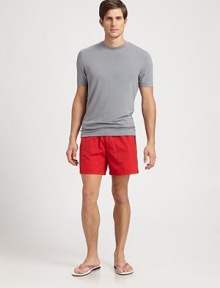 Classic, solid print swim trunk designed in a shorter, modern fit with contrast detail.Elastic drawstring waistSide slash, back welt pocketsMesh liningInseam, about 5PolyamideMachine washMade in Italy Classic, solid print swim trunk designed in a shorter, modern fit with contrast detail.Elastic drawstring waistSide slash, back welt pocketsMesh liningInseam, about 5PolyamideMachine washMade in Italy
