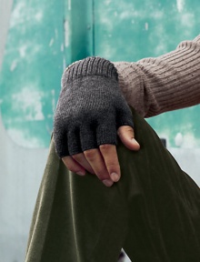 EXCLUSIVELY OURS. Stylish fingerless gloves are knitted from superior wool, offering easy access to your everyday essentials while keeping your hands warm and toasty.About 8 longWoolDry cleanImported