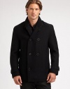 A modern fit, double-breasted peacoat is tailored from superior wool featuring a plaid lining and a ribbed-knit collar for a timeless design that will last throughout this cold-weather season and beyond.Button-frontRibbed-knit collarFully linedAbout 32 from shoulder to hemWoolDry cleanImported