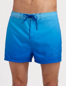 A shorter, classic fit made for sunny beachside days with quick-dry comfort and gently fading color. Drawstring waist Embroidered logo detail Mesh lining Inseam, about 4 Polyester Machine wash Imported A shorter, classic fit made for sunny beachside days with quick-dry comfort and gently fading color. Drawstring waist Embroidered logo detail Mesh lining Inseam, about 4 Polyester Machine wash Imported