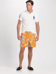 Designed for a relaxed fit, the East Hampton swim trunk is rendered in soft, quick-drying nylon with a bold tropical print.Shoestring waistVelcro® flySide slash pocketsFlap patch pocket on right legPolyester liningInseam, about 7NylonMachine washImported