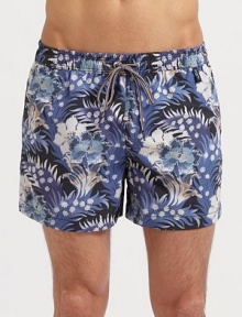 The ultimate tropical style for the beach and beyond in smooth, quick-dry nylon. Elastic drawstring waist Side slash, back zip pockets Mesh lining Inseam, about 4 Nylon Machine wash Imported 