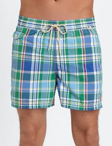 The classic Traveler swim short is rendered in sleek, quick-drying microfiber in a vibrant plaid pattern for cool, casual beach style.Elastic waistband with drawstring tie closureSide slash pocketsBack waist drainage grommetsBack flap patch pocketMesh liningInseam, about 4¾52% cotton/48% nylonMachine washImported