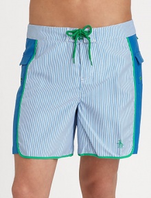 A quick-dry look with printed mini-stripes revive a classic beach style. Drawstring waistBack flap pocketsMesh liningInseam, about 6PolyesterMachine washImported A quick-dry look with printed mini-stripes revive a classic beach style. Drawstring waistBack flap pocketsMesh liningInseam, about 6PolyesterMachine washImported