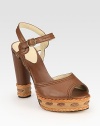 Intricately stitched leather platform with braided leather trim and an adjustable ankle strap. Self-covered heel, 4½ (115mm)Stitched leather platform, 1 (25mm)Compares to a 3½ heel (90mm)Leather upperLeather lining and solePadded insoleMade in ItalyOUR FIT MODEL RECOMMENDS ordering true size. 