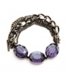 A fashionable finishing touch. Faceted glass accents in rich purple add the perfect pop of color to Kenneth Cole New York's stretch bracelet. The stretch design makes it comfortable and easy to wear. Set in hematite tone mixed metal. Includes a signature gift box. Approximate length: 7-1/2 inches.