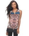 Top off your leggings with INC's sleeveless tunic, broadcasting a bold print!