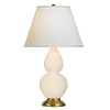 Bone glazed ceramic finish. Three way switch. Antique natural brass finished accents. Pearl Dupioni fabric shade.