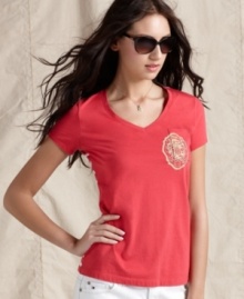 Join the cool crown in Tommy Hilfiger's V-neck logo tee, rendered in super-soft cotton. The solid front and striped back is so summery, too! Join the cool crown in Tommy Hilfiger's V-neck logo tee, rendered in super-soft cotton. The solid front and striped back is so summery, too!
