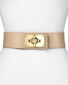A bold turnlock asserts tough-girl glamour on this Tory Burch belt, composed of smooth leather and elastic. It's an edgy must-have over a body-con mini dress with towering stiletto booties. A bold turnlock asserts tough-girl glamour on this Tory Burch belt, composed of smooth leather and elastic. It's an edgy must-have over a body-con mini dress with towering stiletto booties.