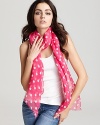 Go for ladylike style with a sheer lightweight scarf in a classic polka dot print from Lauren Ralph Lauren.