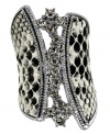 Set the mood with this GUESS stretch ring, featuring black and white python print and glass stone accents. Set in imitation rhodium-plated mixed metal. Ring stretches to fit finger.