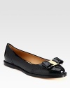Classic functional silhouette of polished patent leather with a charming logo-adorned bow. Patent leather upperLeather lining and solePadded insoleMade in ItalyOUR FIT MODEL RECOMMENDS ordering true size. 