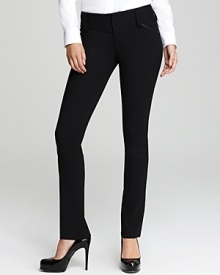 Leather trim lends a luxe edge to these Alice + Olivia slim pants, designed in stretch wool for a sleek silhouette. Leather trim lends a luxe edge to these Alice + Olivia slim pants, designed in stretch wool for a sleek silhouette.