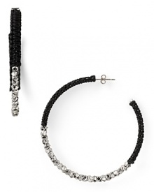 Cool and crafty. A simple shape gets a Gothic shot of color with these plated hoop earrings from Shashi, wrapped in black cord. Cool and crafty. A simple shape gets a Gothic shot of color with these plated hoop earrings from Shashi, wrapped in black cord.