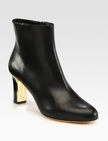 A sleek and sexy design of fine Italian leather with an unexpected goldtone heel. Stacked and lacquered heel, 2¾ (70mm)Leather upperSide zipLeather lining and solePadded insoleMade in ItalyOUR FIT MODEL RECOMMENDS ordering one half size up as this style runs small. A sleek and sexy design of fine Italian leather with an unexpected goldtone heel. Stacked and lacquered heel, 2¾ (70mm)Leather upperSide zipLeather lining and solePadded insoleMade in ItalyOUR FIT MODEL RECOMMENDS ordering one half size up as this style runs small.