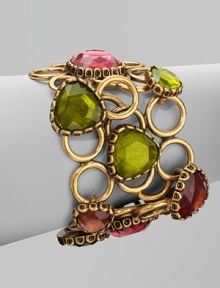 An unique style with brightly colored, hand-poured resin cabochons set atop a fused open ring bracelet. Resin stonesBrass and pewterLength, about 7½Toggle closureMade in USA