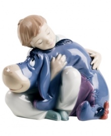 A sweet boy brings a smile even to Eeyore's face in this heartwarming figurine for Winnie the Pooh fans and Lladro collectors.