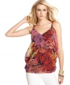 An allover bright leaf print brings bold summer style to this Andrew Charles tank -- perfect over the season's white denim!