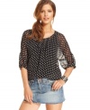 An allover polka-dot print adds an irreverent appeal to this Bar III chiffon blouse!