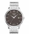 As dependable as it is eye-catching, this Tissot timepiece brings everyday style. Tradition collection watch crafted of stainless steel bracelet and round case. Black dial features silver tone applied stick indices, minute track, date window at three o'clock, numerals at twelve and six o'clock, three hands and logo. Swiss quartz movement. Water resistant to 30 meters. Two-year limited warranty.