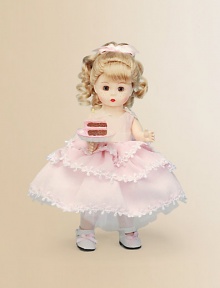 This pretty blonde miss brings birthday wishes to a lucky young lady on her special day.8 cloth dollDressed in a pink, tiered, lace-trimmed frock and white Mary Jane slippersShe offers a luscious-looking slice of birthday cakeRecommended for ages 3 and upImported