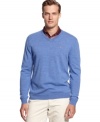 Look great perfecting your swing with this pullover sweater by Greg Norman for Tasso Elba.