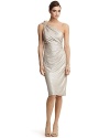 This one-shoulder number from David Meister is a gleaming metallic statement of style. Jeweled floral embellishment on straps. Neutral heels provide a perfect balance.