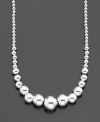 Cool and classic, this graceful strand of graduated sterling silver beads by Giani Bernini is an essential complement to career attire. Approximate length: 18 inches.