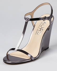 Modern and minimal, these sleek wedges from KORS Michael Kors boast clean lines on a simple silhouette. Modern and minimal, these sleek wedges from KORS Michael Kors boast clean lines on a simple silhouette.