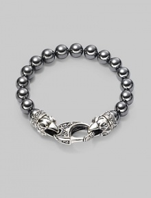 A new look for the modern man, handsomely crafted with a sterling silver raven's head clasp and a string of hematite beads. Sterling silver 10mm hematite beads Lobster clasp closure Bracelet, 9 long Imported A new look for the modern man, handsomely crafted with a sterling silver raven's head clasp and a string of hematite beads. Sterling silver 10mm hematite beads Lobster clasp closure Bracelet, 9 long Imported