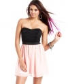 An exposed back zipper toughens the femme design of this strapless, colorblock dress from Material Girl!