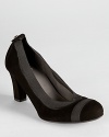 Easy and effortless, these Stuart Weitzman pumps slip on and go in soft black suede with elastic trim.