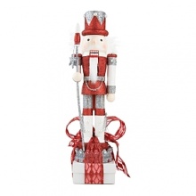 The Platinum Grande Nutcrackers shimmer and shine atop an assortment of red, white and black boxes. The Platinum Grande Nutcrackers shimmer and shine atop an assortment of red, white and black boxes.