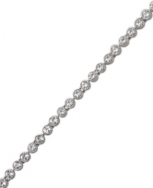 A timeless classic that can be worn alone or paired with other bracelets for a chic layered look. Swarovski's tennis bracelet features sparkling clear crystals in silver tone mixed metal. Approximate length: 7-1/2 inches. A timeless classic that can be worn alone or paired with other bracelets for a chic layered look. Swarovski's tennis bracelet features sparkling clear crystals in silver tone mixed metal. Approximate length: 7-1/2 inches.